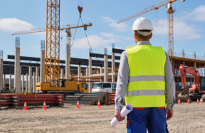 Construction site inspector reviewing a build in progress