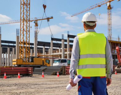 Construction site inspector reviewing a build in progress