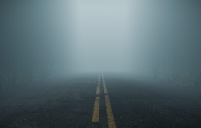 Misty, foggy road representing uncertainty and unpredictability
