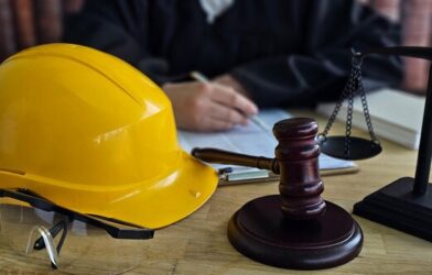 Courtroom setting with construction hat and gavel - workplace prosecution
