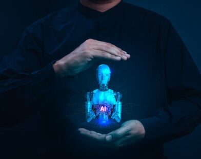 Human hands protecting AI robot hologram - responsible artificial intelligence
